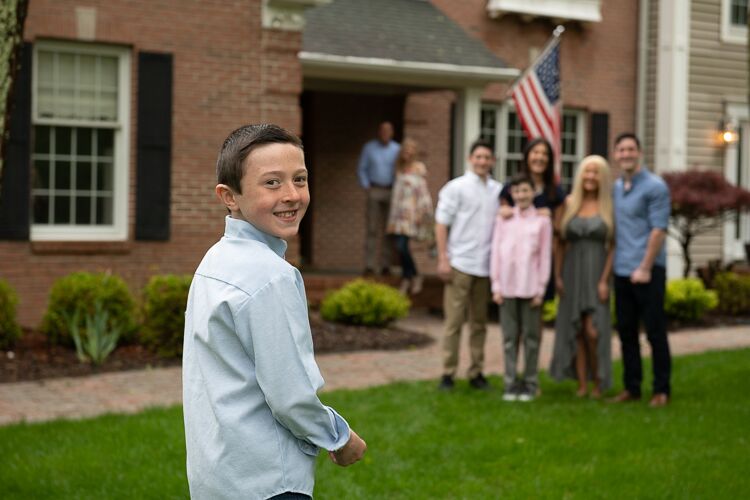 charlie smiling in forefront, family in background