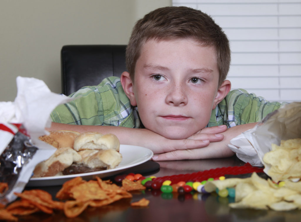 Boy eating junk food